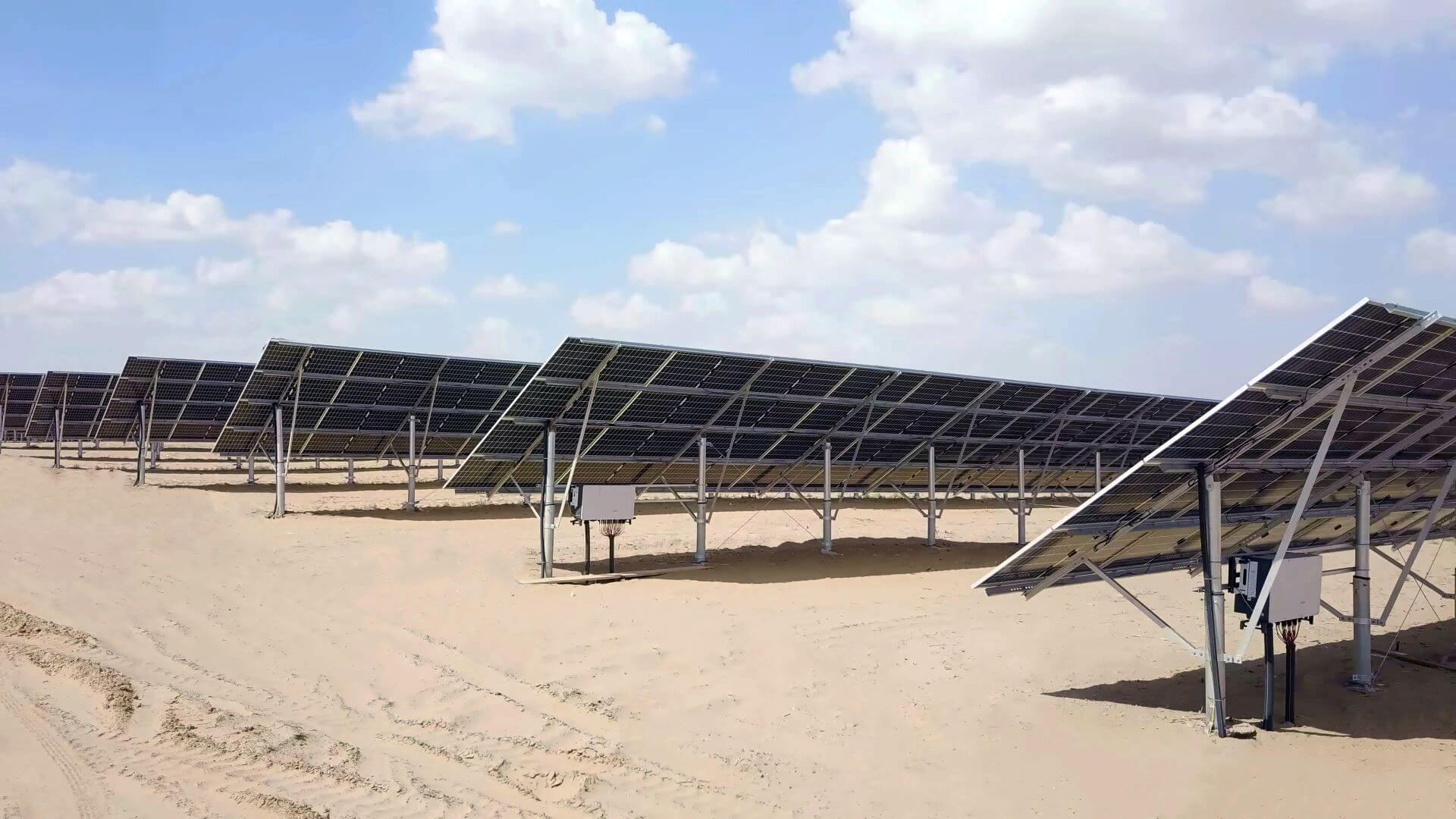 rows of solar panels in desert