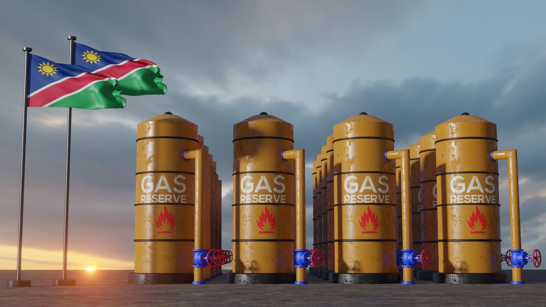 stylised gas storage tanks next to two Namibian flags