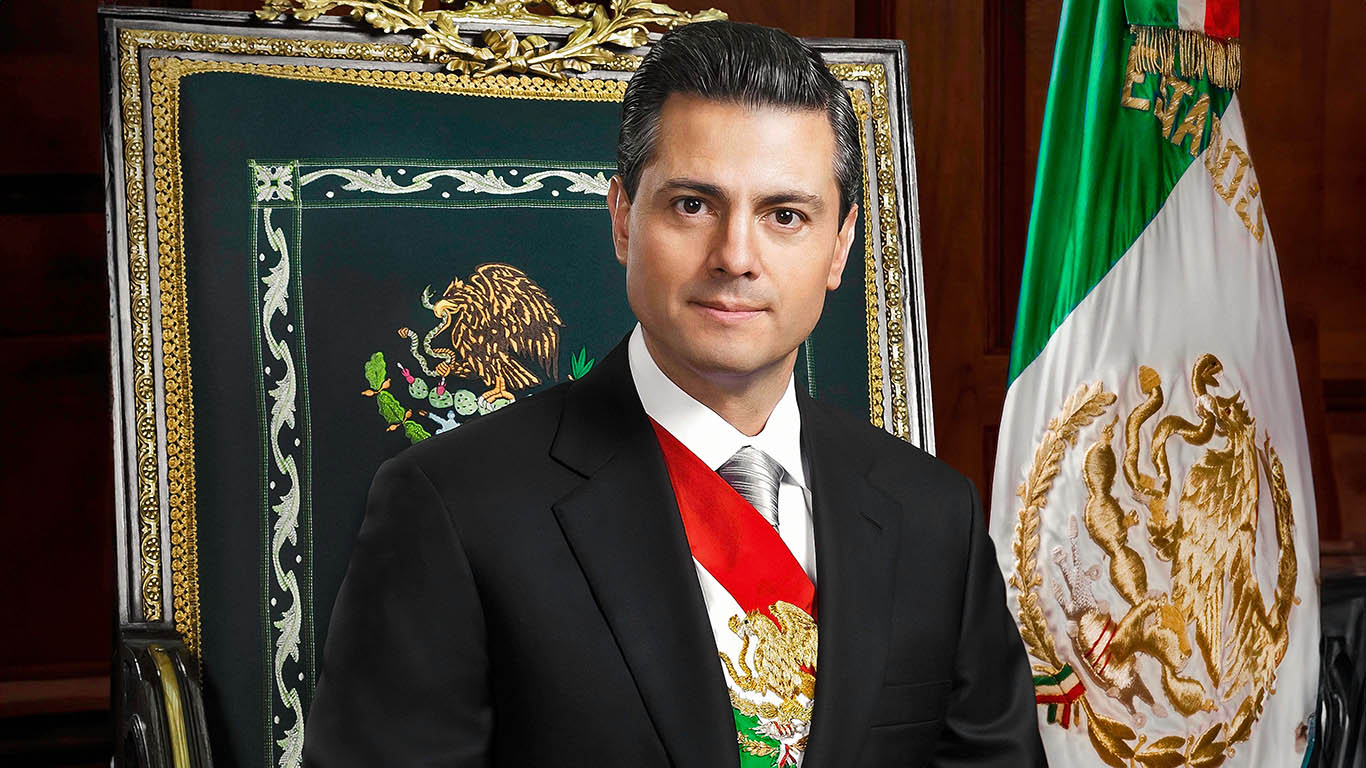 former Mexicon President Enrique Pena Nieto sitting in government chair in trappings of high office
