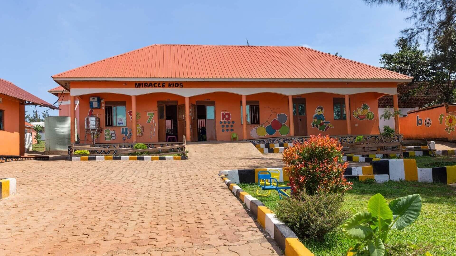 outside of Ugandan nursery building front entrance and pathway