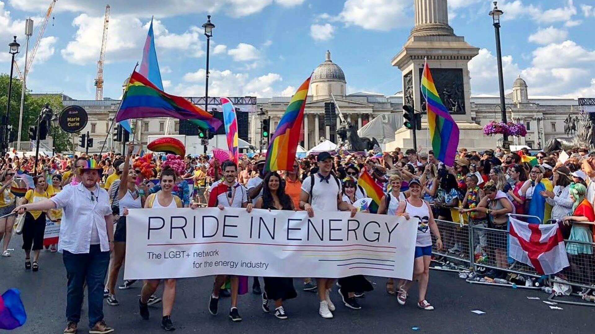 Diverse array of people walking on Pride march