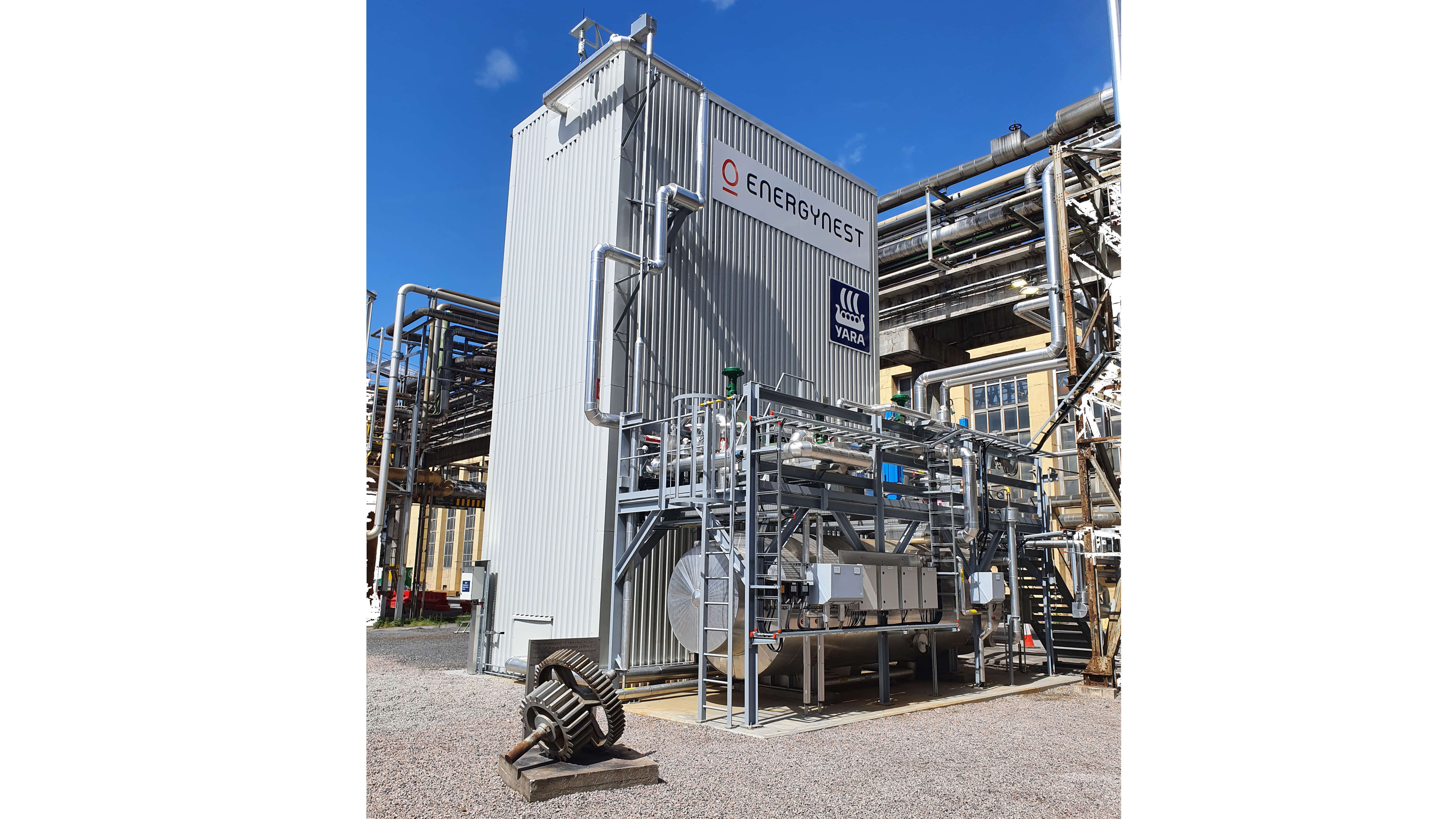 rectangular industrial building surrounded by pipework